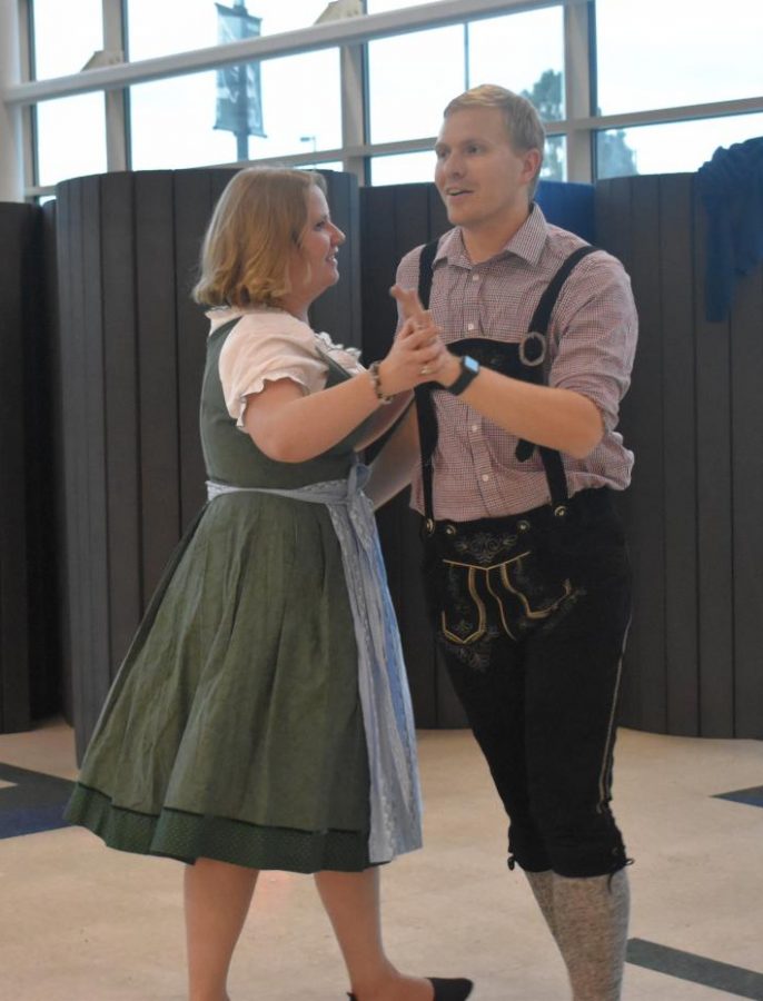 Herr Frie and his wife demonstrate a traditional Bavarian dance at the Oktoberfest celebration held on October 1. 