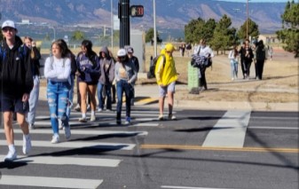 Students crossing the road to go to 7-11.