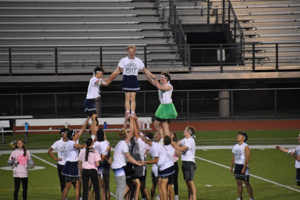 The male cheerleaders form a pyramid during the halftime show.